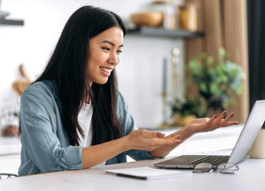 Woman having a virtual consultation with their orthodontist, using their laptop.